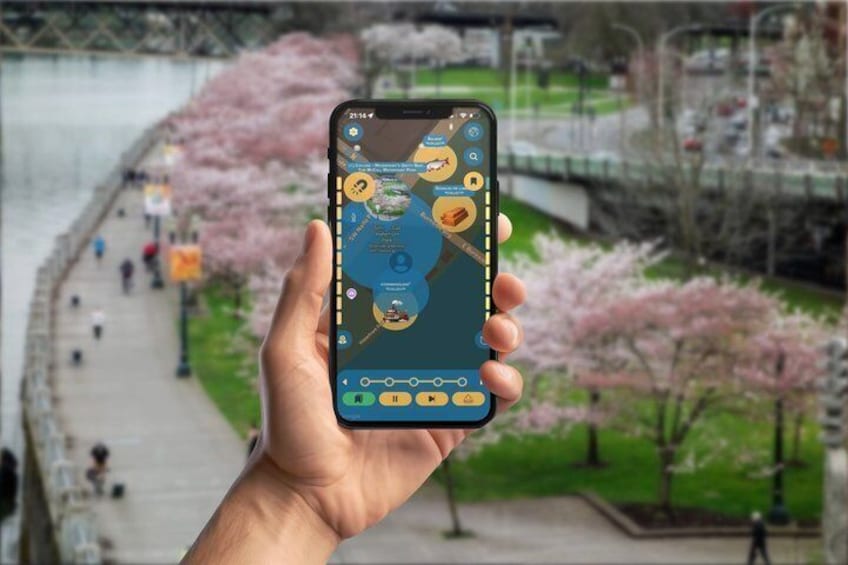 A hand holding a smartphone displaying a map with various points of interest. 2