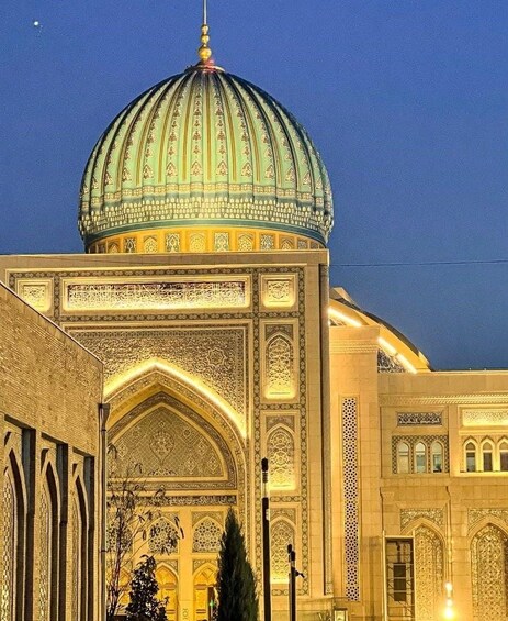A large, ornate building with a prominent dome and intricate architectural details. 1