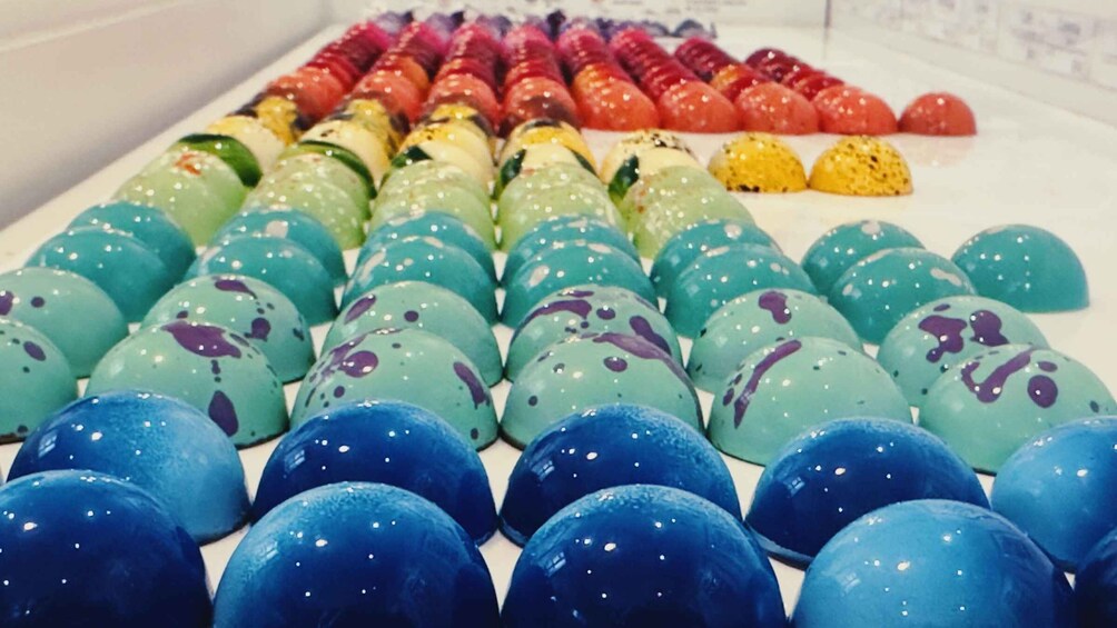 A variety of colorful, spherical objects arranged in rows. 3