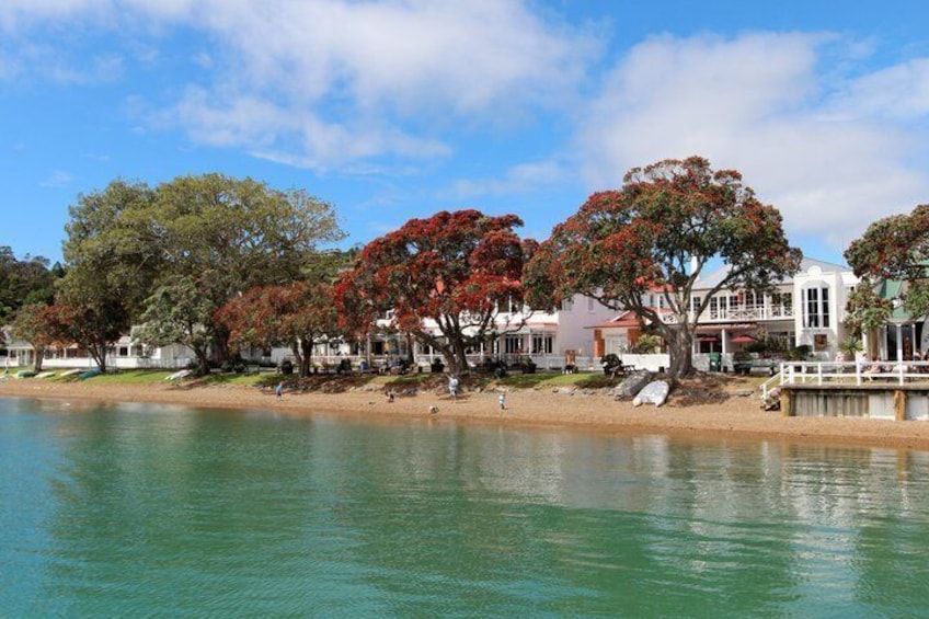 A lake with houses and trees along the shore. 2