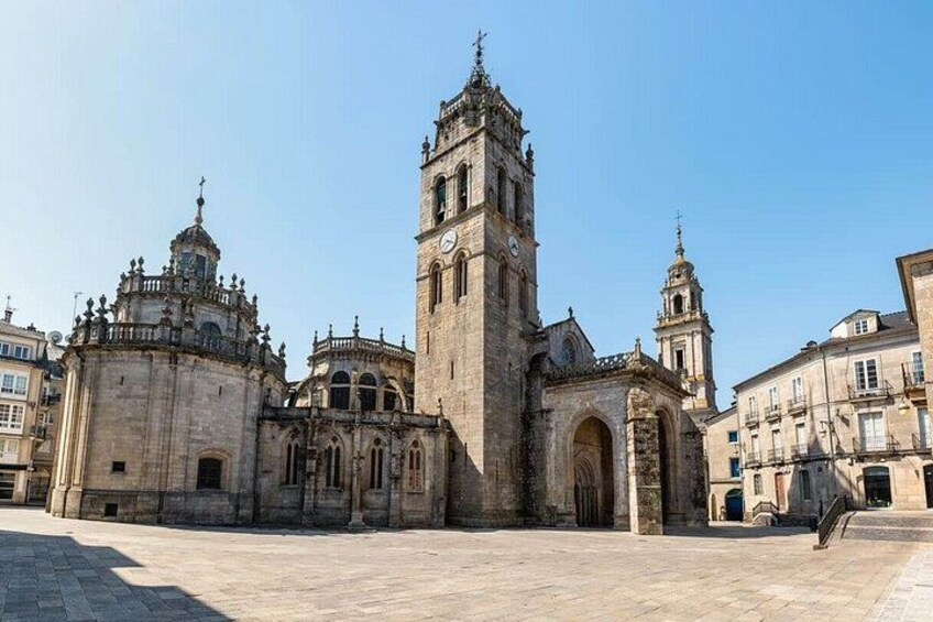 A historic church with a prominent bell tower and intricate architecture. 4