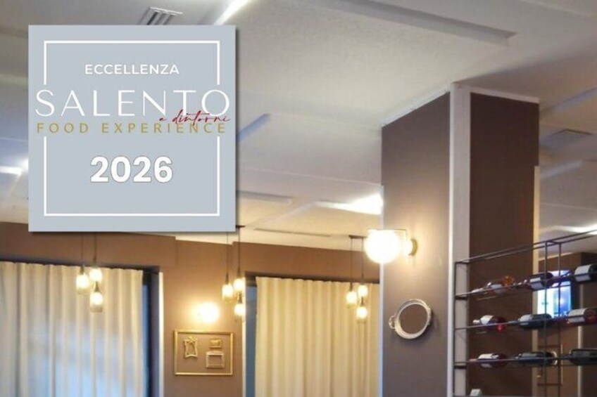A modern interior with a sign for ECCELLENZA SALENTO FOOD EXPERIENCE 2026. 3