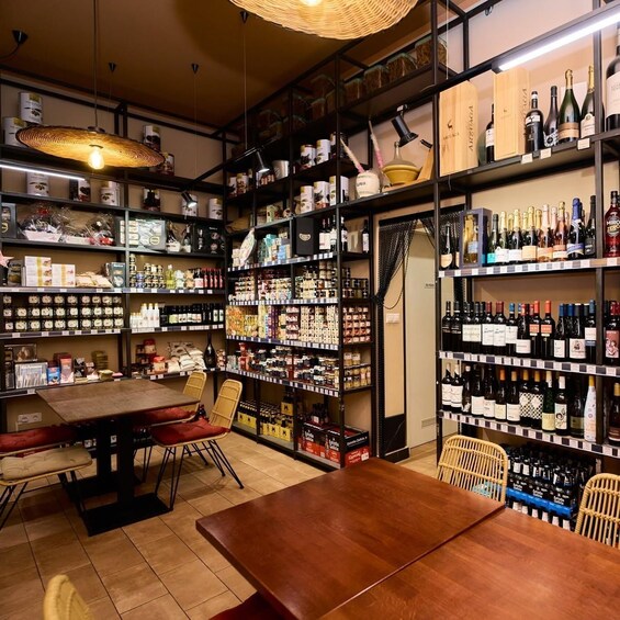 A well-stocked liquor store with shelves of bottles and boxes. 3