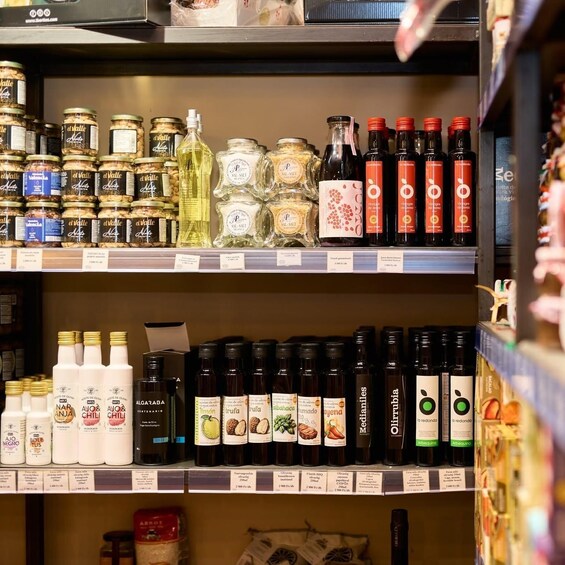 Shelves stocked with various food products including jars, bottles, and containers. 4