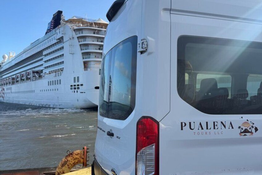 A white van with 'PUALENA TOURS LLC' written on the side parked next to a large cruise ship. 3