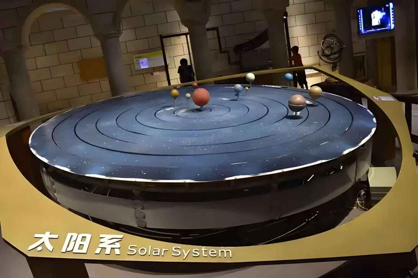 A solar system model with planets orbiting around a central sun. 4
