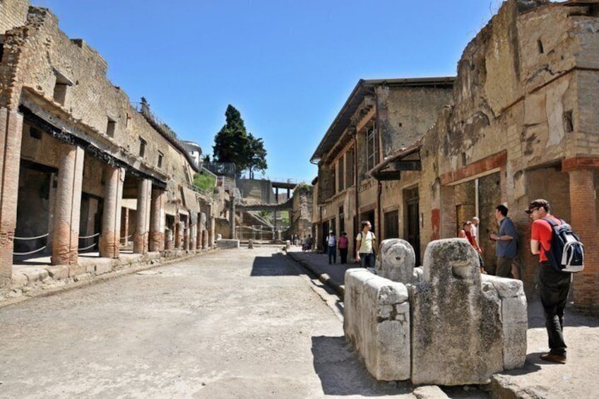 Ancient ruins with columns and a clear sky. 4