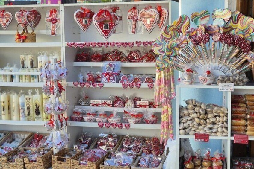 Shelves stocked with heart-shaped decorations, lollipops, and other items. 2