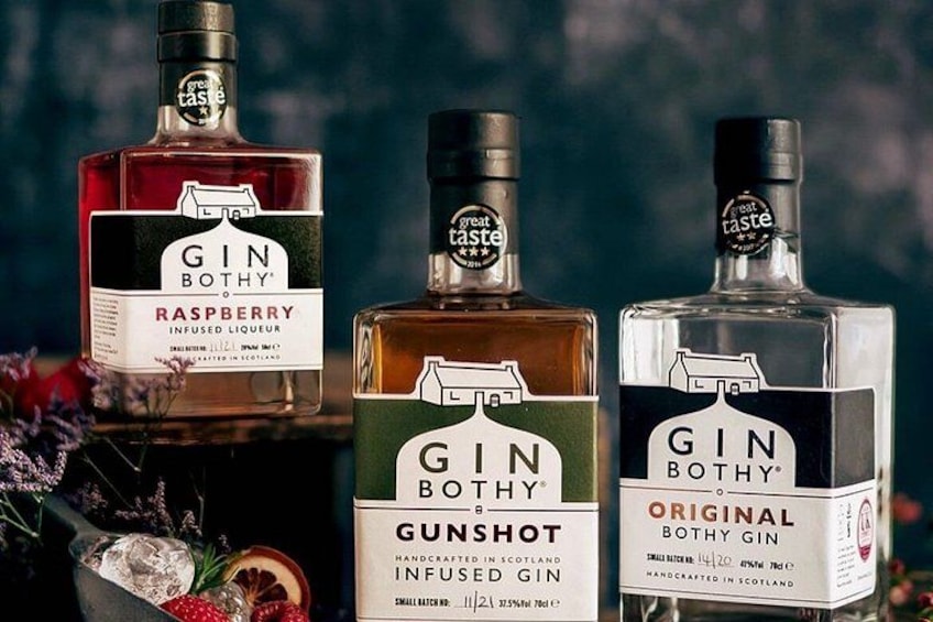 Three bottles of Gin Botthy gin with labels indicating different flavors: Raspberry, Gunshot, and Original. 3