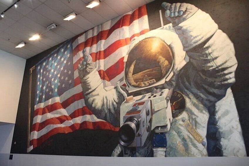A mural of an astronaut with an American flag in the background. 5