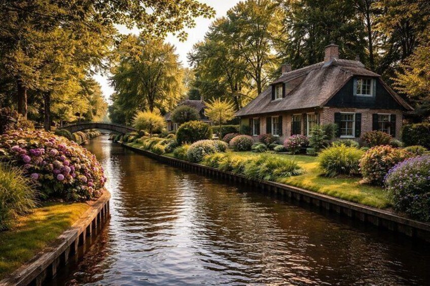 A canal with a house and lush greenery. 4