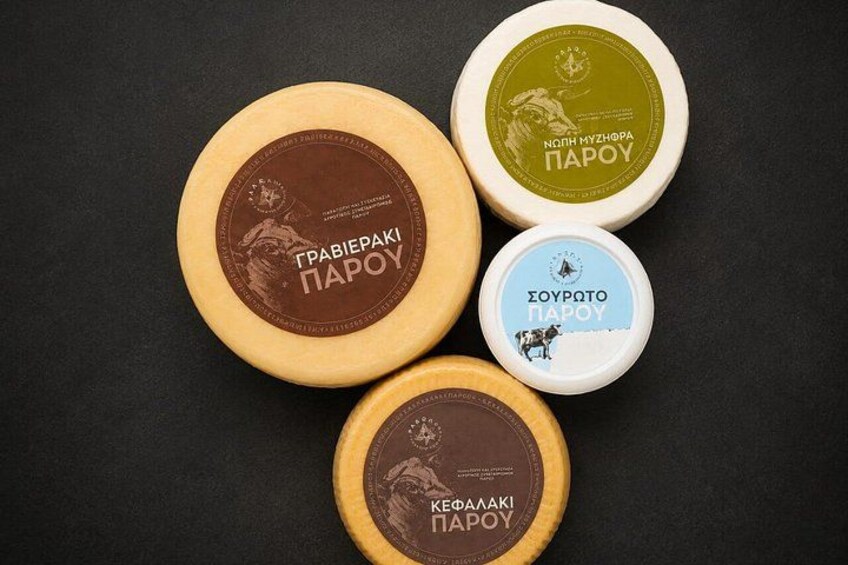 Four cheese wheels with labels. 2