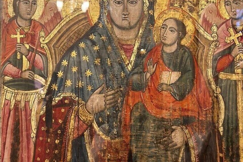 A religious icon with figures in traditional attire, one holding a book and another a cross. 4
