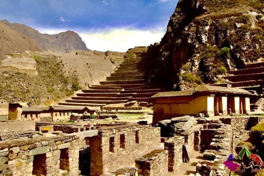 Ancient ruins with stepped terraces and stone structures. 3