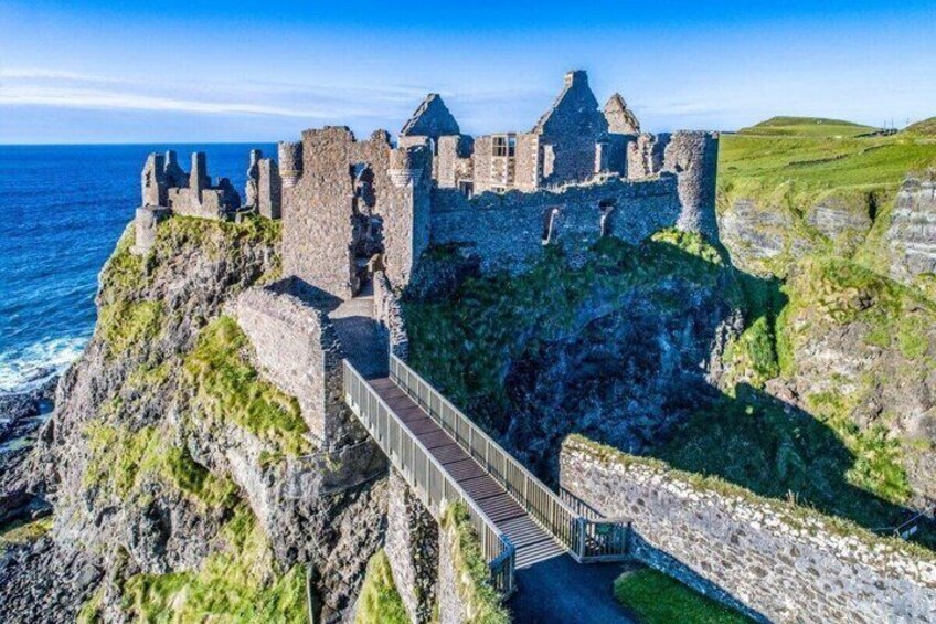 A historic castle on a cliff overlooking the sea. 5