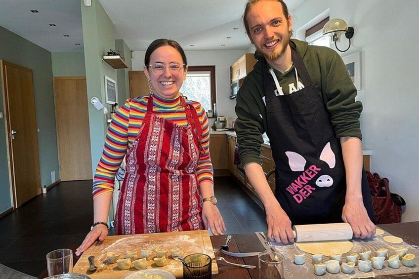 Two people in a kitchen preparing food. 2