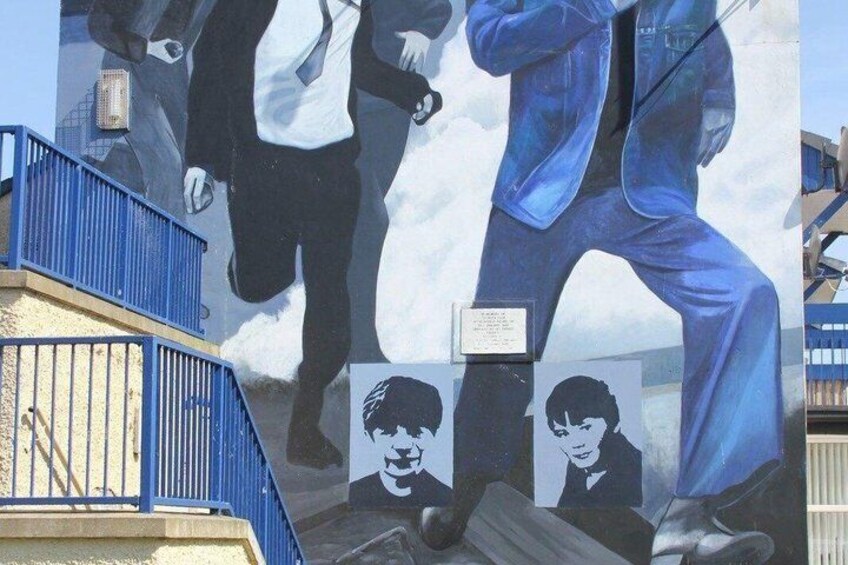 A mural with a man in a suit and a child. 4