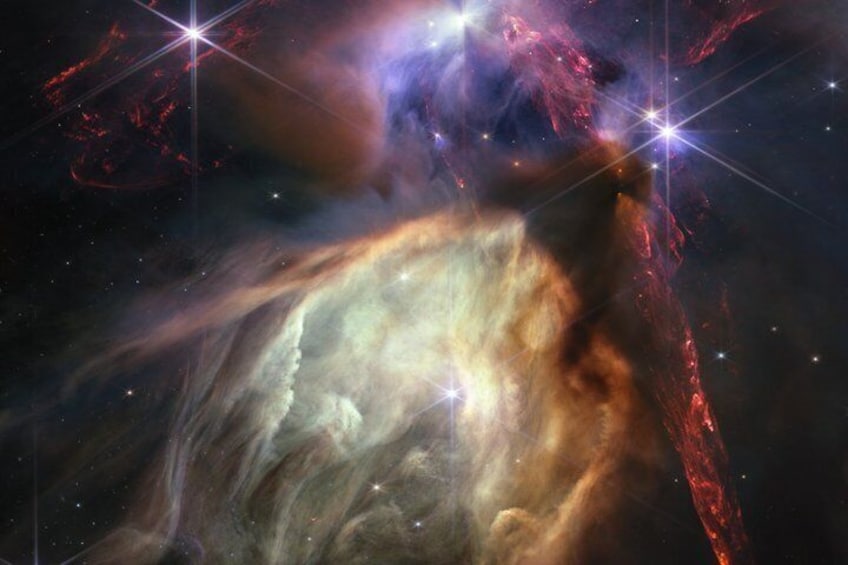 A nebula with bright stars and a large cloud of gas and dust. 3