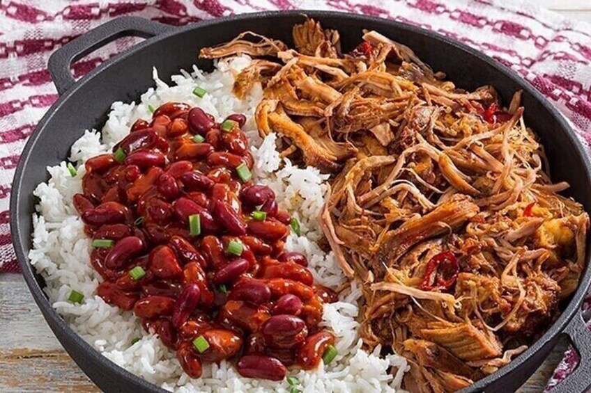 A skillet with white rice, red kidney beans, and shredded meat. 5