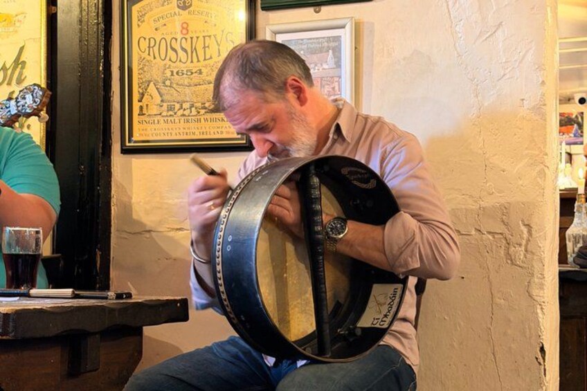 A person playing a barrel organ. 4