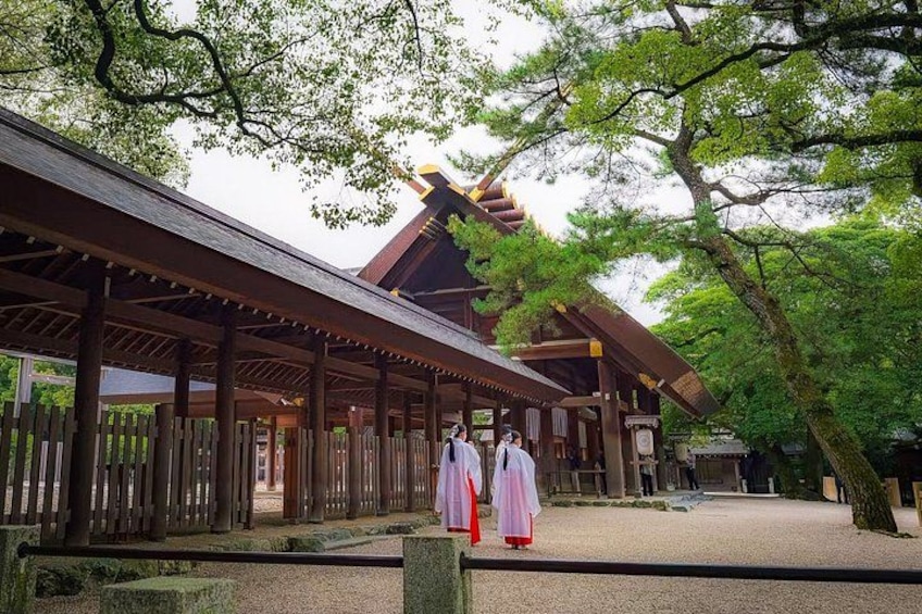 A traditional Japanese building with a wooden structure and a covered walkway. 1