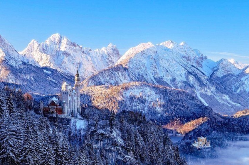 A snow-covered mountain landscape with a church and a castle. 3