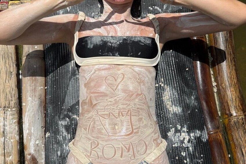 A person wearing a corset with the text 'ROMA' and a heart symbol. 5
