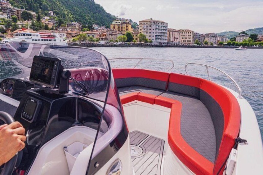A boat on water with a cityscape in the background. 3