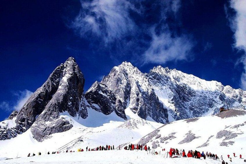 A snow-covered mountain range with a clear sky. 2