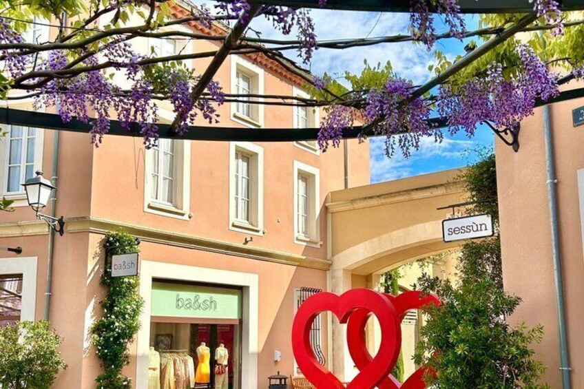 A boutique store named 'ba&sh' with a heart-shaped decoration in front. 3