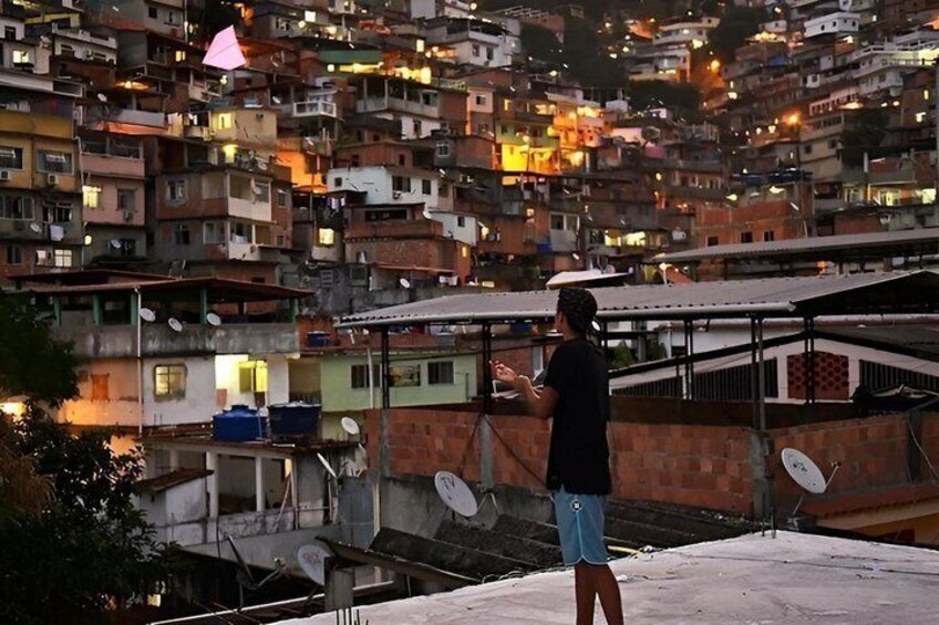 A densely packed urban area with numerous buildings at dusk. 3