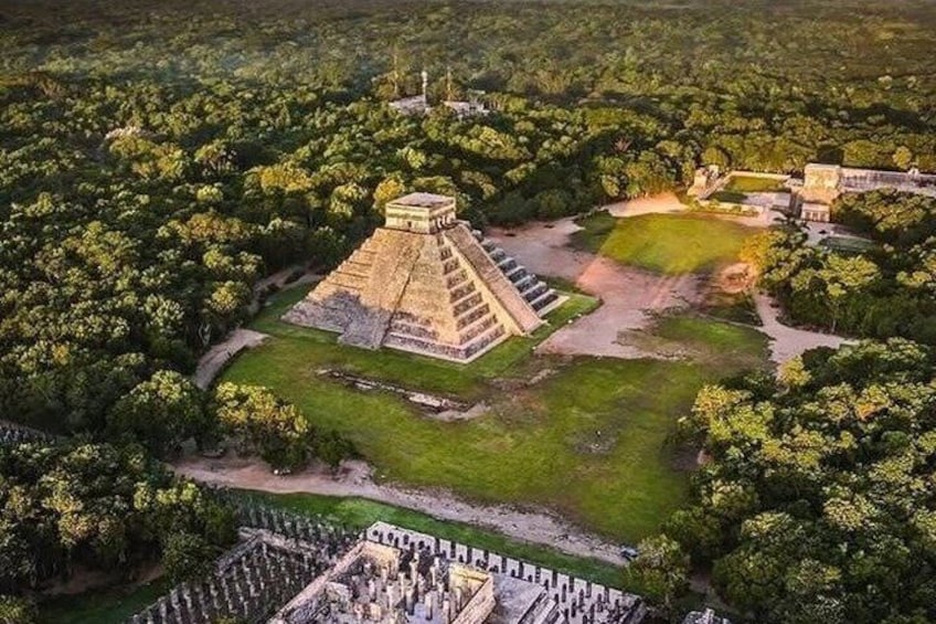 An ancient pyramid complex surrounded by dense forest. 1