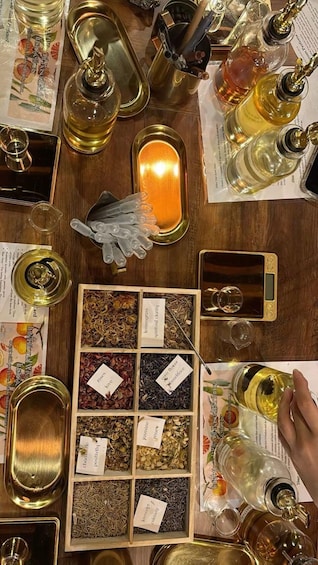 A variety of essential oils and extracts displayed on a wooden table, surrounded by bottles and containers. 3