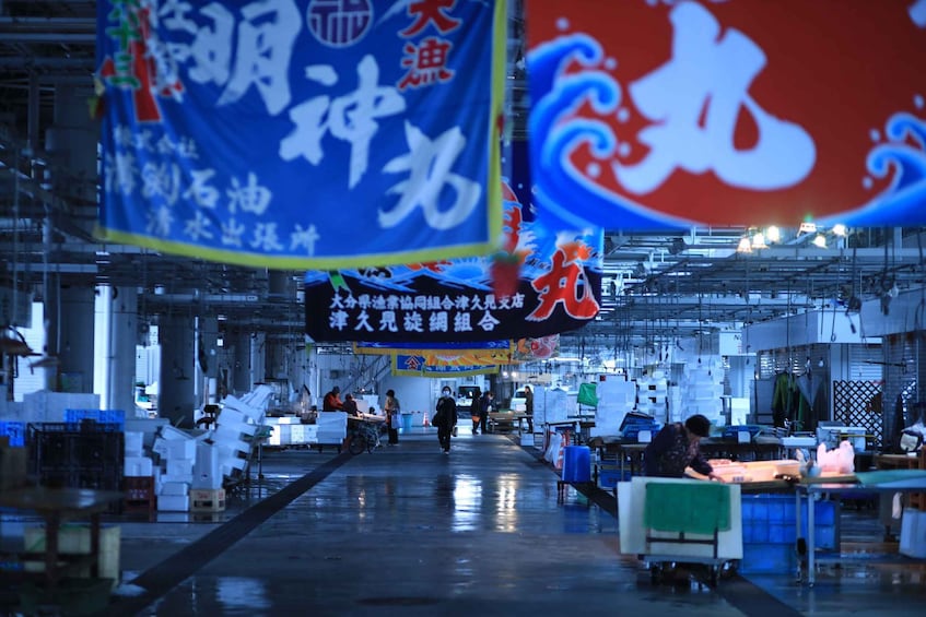 An industrial setting with machinery and workers. 3