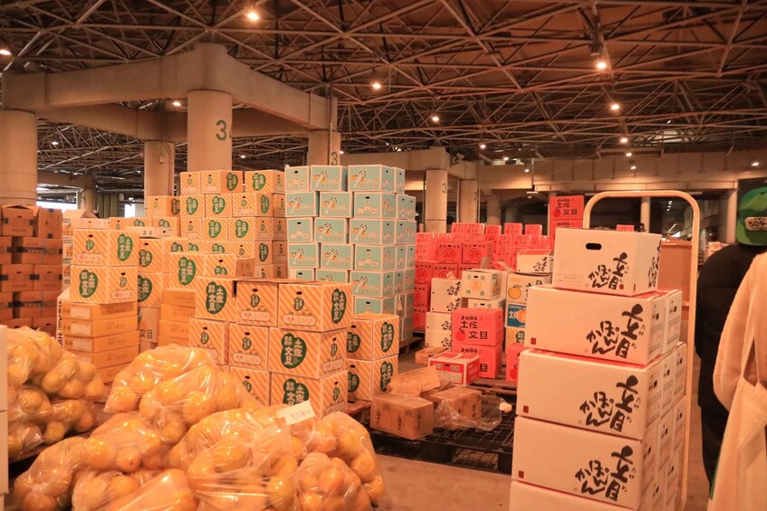 A warehouse with stacks of boxes and bags of goods. 2
