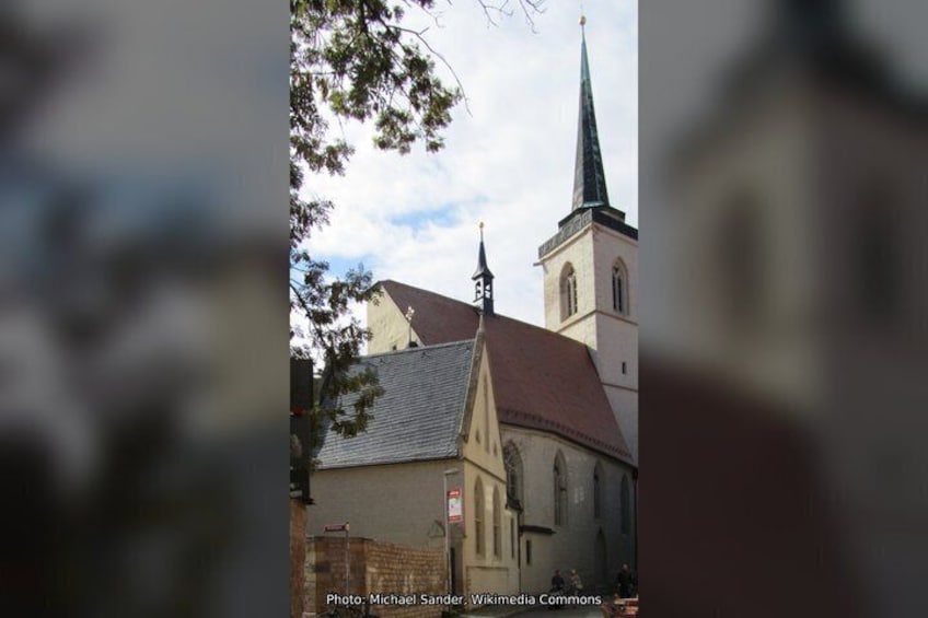 A church with a steeple and a clock tower. 5