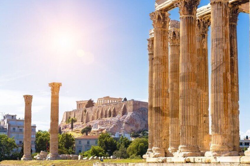 Ancient Greek columns, a historical building, and a clear sky. 2