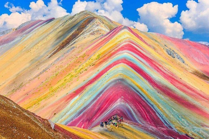 A multicolored mountain with a clear sky. 1