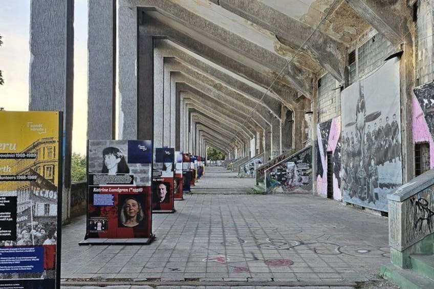 An abandoned building with graffiti and posters. 2