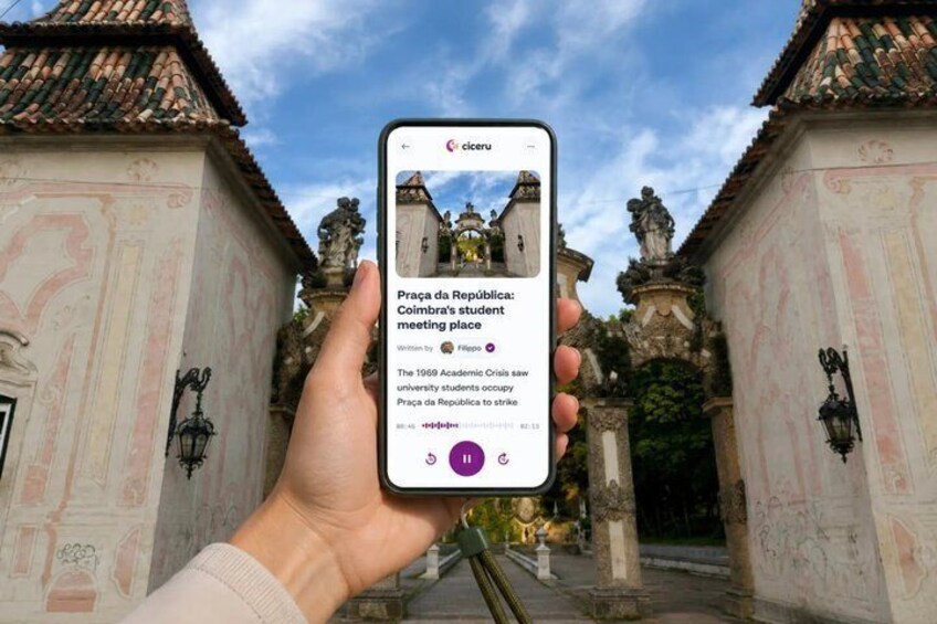 A hand holding a smartphone displaying a photo of Praça da República with text overlay. 1