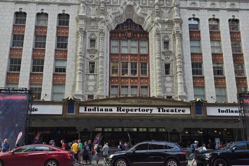 The Indiana Repertory Theatre building with ornate architecture and a crowd of people in front. 5