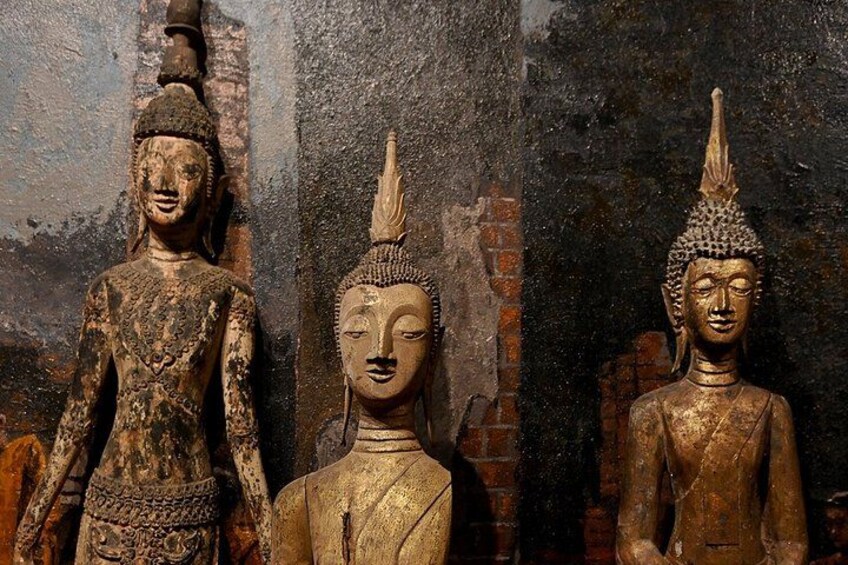Three statues of Buddha in different postures. 3