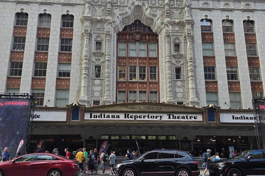 The Indiana Repertory Theatre building with ornate architecture and a crowd of people in front. 5