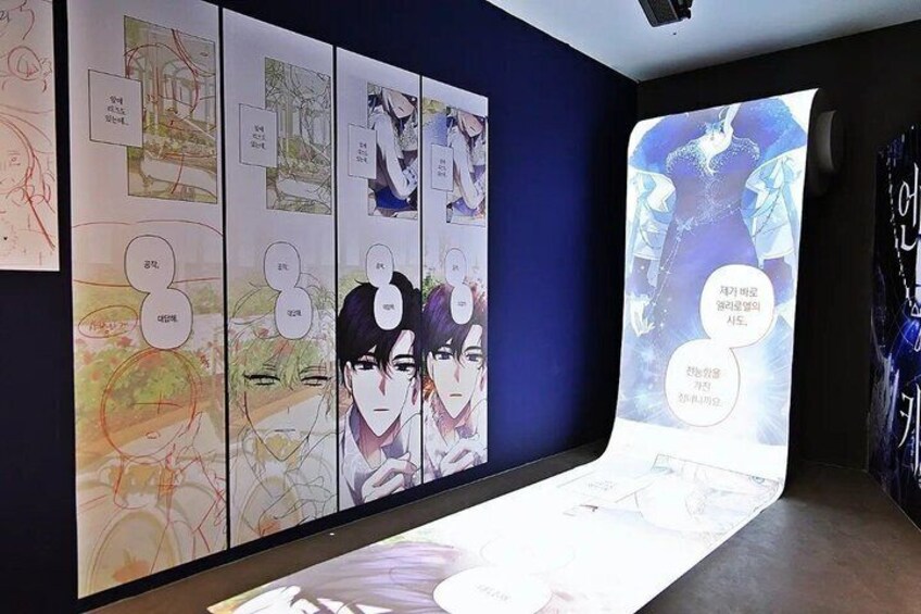 A wall with manga-style illustrations and text bubbles. 5