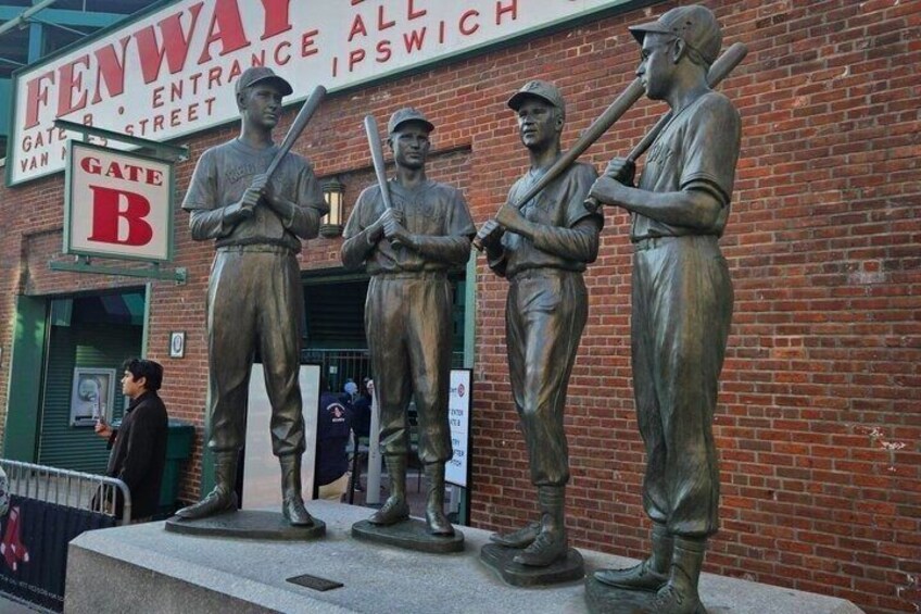 A bronze statue of baseball players in front of Fenway entrance. 1