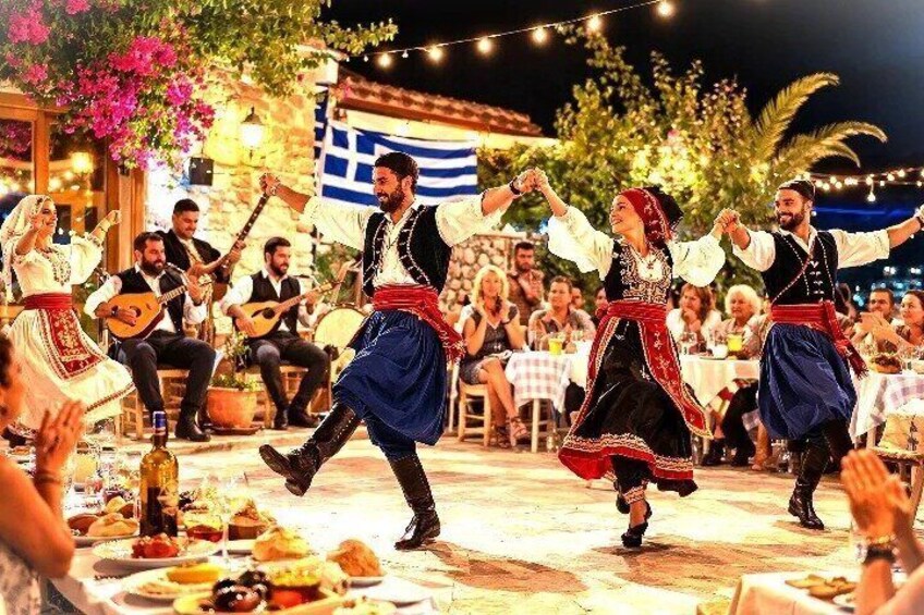 A traditional dance performance with musicians in a festive outdoor setting. 1