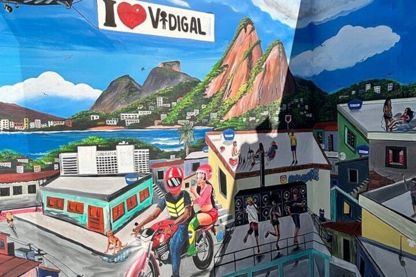 A mural with a cityscape, mountains, and a beach. 3