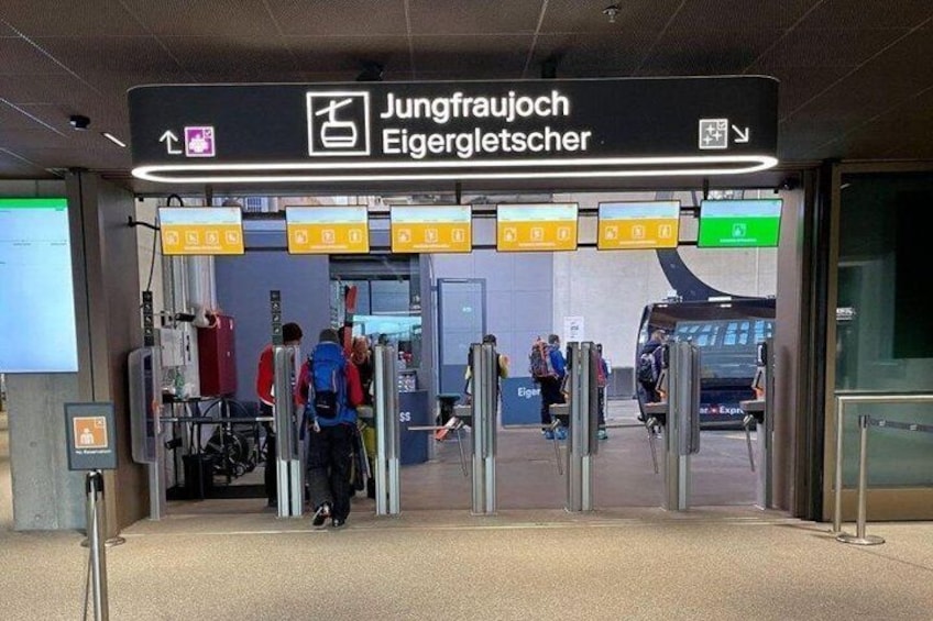A train station entrance with a sign reading 'Jungfraujoch Eisengettscher'. 4