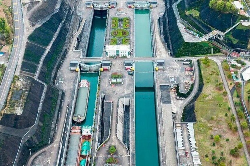 A large dam with multiple water channels and a bridge. 2