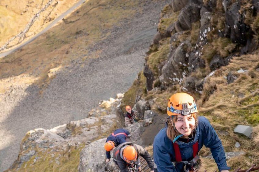 Two people climbing a rocky mountain path. 4